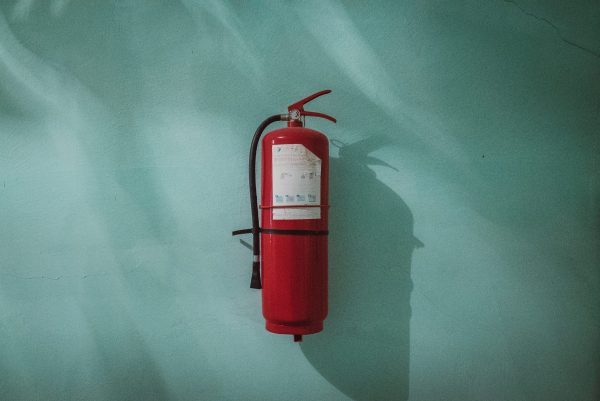 Fire Extinguisher on Blue Wall